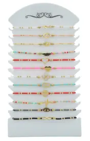 Bracelet élastique perles et motifs couleurs assorties x12