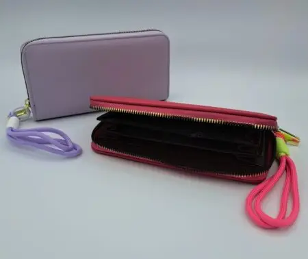 Compagnon zippé en PU avec lance design. Couleurs assorties x12