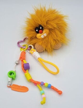 Porte-clés charms accessoire pour sac tête de lion affreux. Couleurs assorties